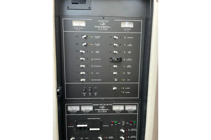 It's About Time Yacht Photos Pics Electrical control panel of 2022 Regal 38 Grande Coupe yacht, featuring various switches and indicators.
