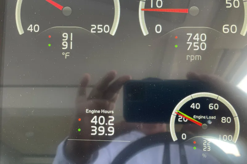 It's About Time Yacht Photos Pics Dashboard of 2022 Regal 38 Grande Coupe showing engine metrics and temperature.