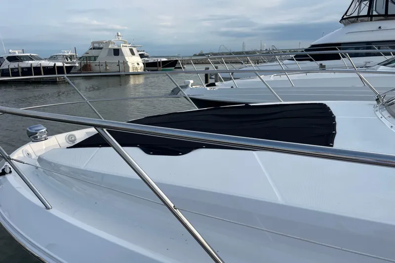 It's About Time Yacht Photos Pics 2022 Regal 38 Grande Coupe yacht docked at marina, sleek design, calm waters.