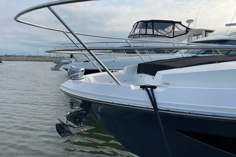 It's About Time Yacht Photos Pics 2022 Regal 38 Grande Coupe yacht docked in marina, side view.