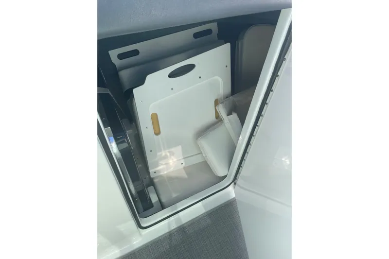  Yacht Photos Pics Storage compartment in 2016 Formula 330 Crossover Bowrider boat, featuring organized interior space.