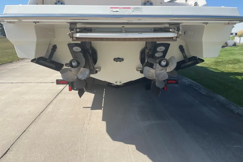  Yacht Photos Pics 2016 Formula 330 Crossover Bowrider boat stern with dual propellers on a sunny day.