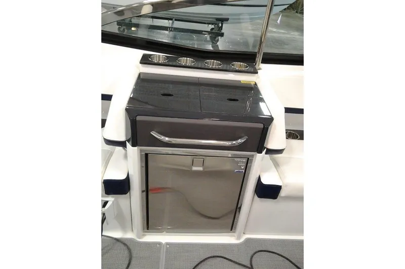  Yacht Photos Pics 2016 Formula 330 Crossover Bowrider interior with built-in storage and cup holders.