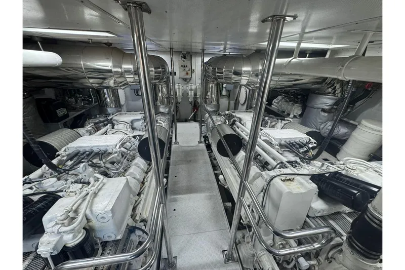  Yacht Photos Pics Engine room of 2003 Sanlorenzo SL88 yacht, featuring dual engines and polished metal components.