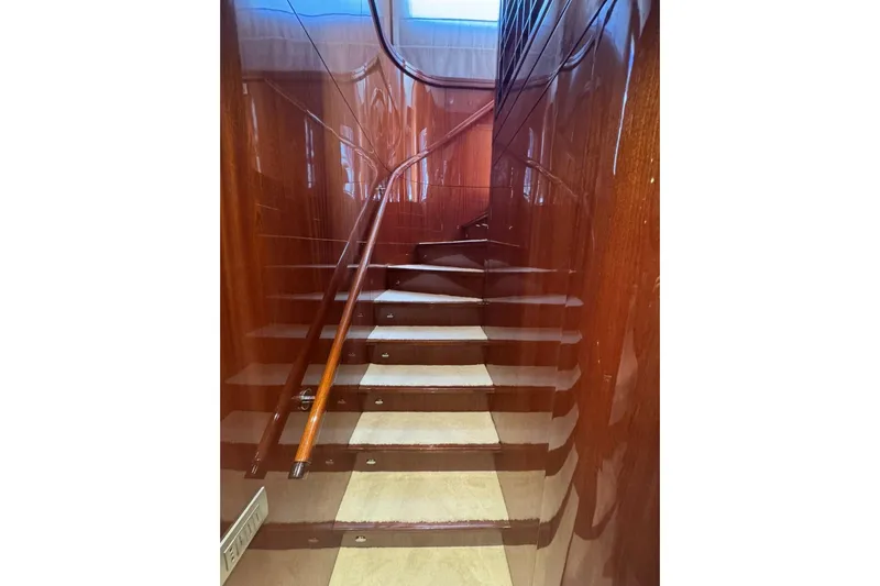  Yacht Photos Pics Staircase with polished wood finish on 2003 Sanlorenzo SL88 yacht interior.