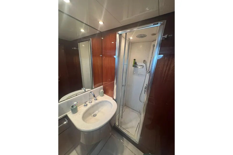  Yacht Photos Pics Luxurious bathroom on 2003 Sanlorenzo SL88 yacht with modern shower and elegant sink.