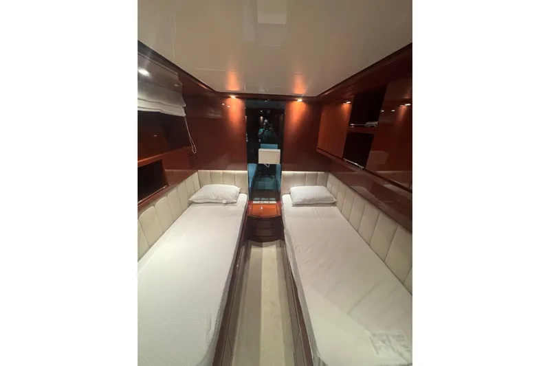  Yacht Photos Pics Luxurious twin cabin interior of 2003 Sanlorenzo SL88 yacht with elegant wood finishes.