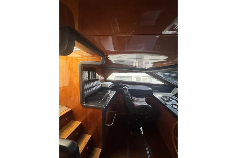  Yacht Photos Pics Luxurious interior of 2003 Sanlorenzo SL88 yacht with leather seating and wooden finishes.