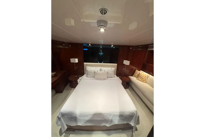 Yacht Photos Pics Luxurious bedroom interior of 2003 Sanlorenzo SL88 yacht with elegant furnishings.