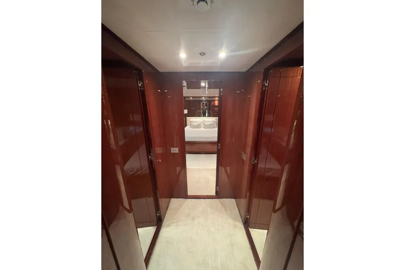  Yacht Photos Pics Luxurious interior hallway of 2003 Sanlorenzo SL88 yacht with polished wood finish.