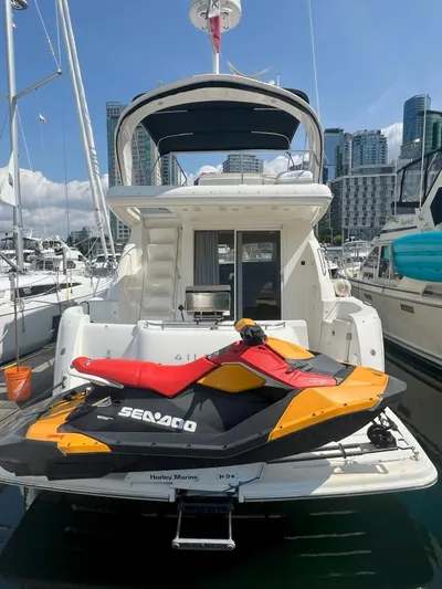  Yacht Photos Pics 2008 Meridian 411 yacht with Sea-Doo jet ski docked at marina.