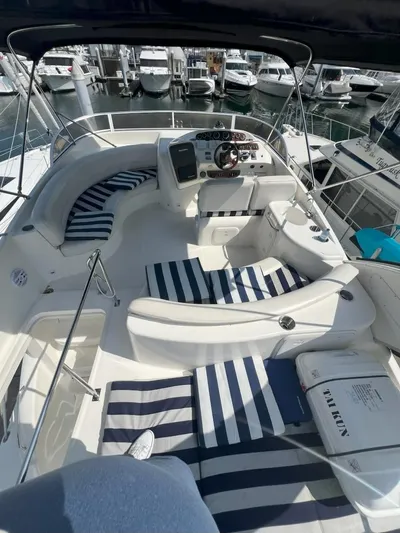  Yacht Photos Pics 2008 Meridian 411 yacht interior with striped cushions at a marina.