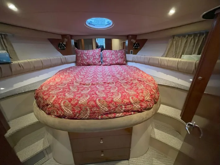  Yacht Photos Pics Luxurious cabin interior of 2008 Meridian 411 yacht with elegant bedding and ambient lighting.