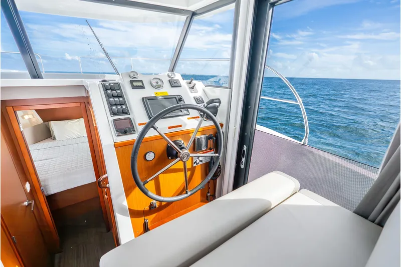  Yacht Photos Pics 2017 Beneteau Swift Trawler 30 helm with ocean view and cozy cabin.