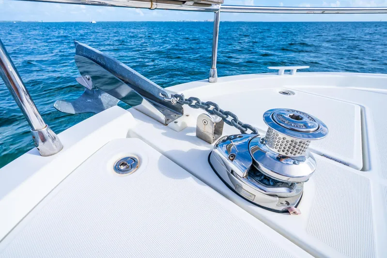  Yacht Photos Pics 2017 Beneteau Swift Trawler 30 anchor and winch on deck, ocean background.