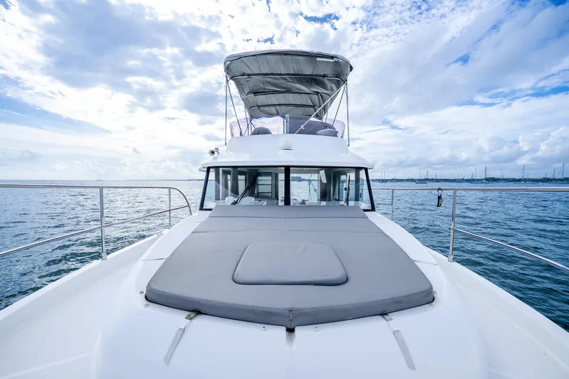  Yacht Photos Pics 2017 Beneteau Swift Trawler 30 on open water under a cloudy sky.