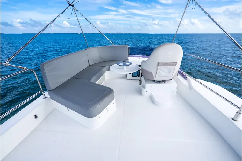  Yacht Photos Pics 2017 Beneteau Swift Trawler 30 deck with seating, ocean view, and clear sky.