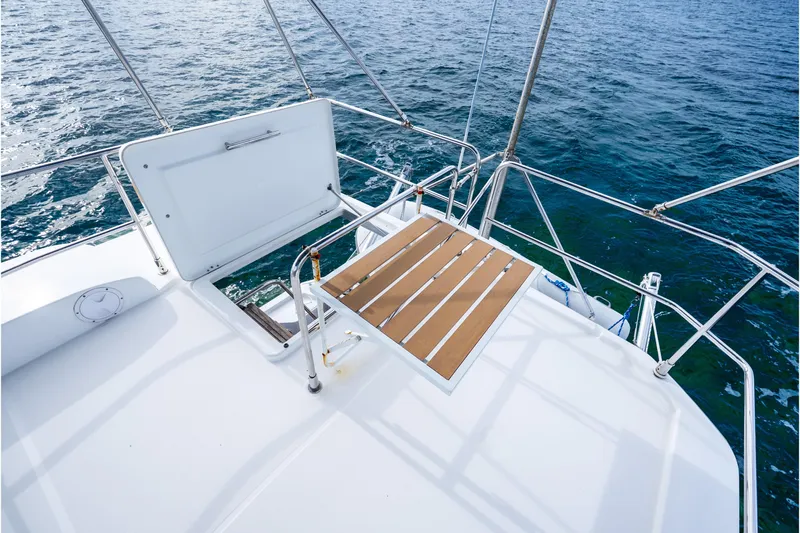  Yacht Photos Pics 2017 Beneteau Swift Trawler 30 deck with open hatch, overlooking ocean waters.