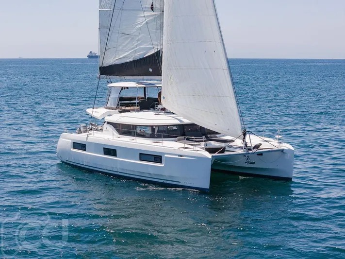 Flying B Yacht Photos Pics 2021 Lagoon 46 catamaran sailing on open sea with full sails.