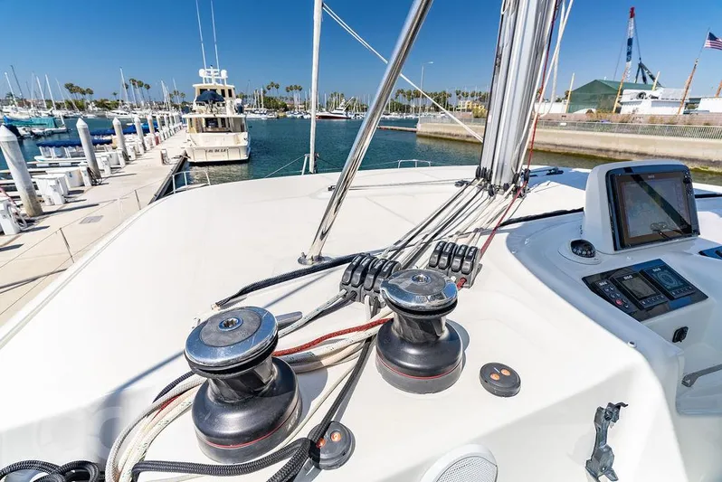 Flying B Yacht Photos Pics Lagoon 46 catamaran deck with winches and control panel, docked at marina, 2021 model.