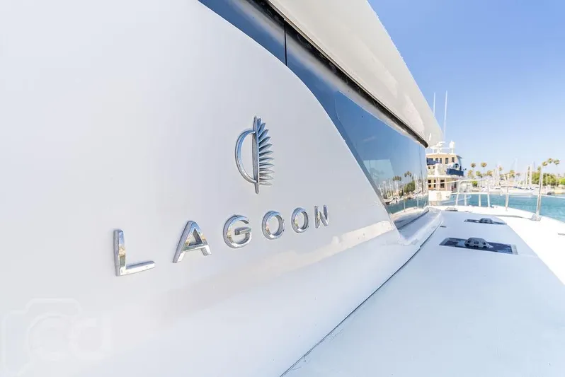 Flying B Yacht Photos Pics 2021 Lagoon 46 yacht, sleek design, docked in sunny marina.
