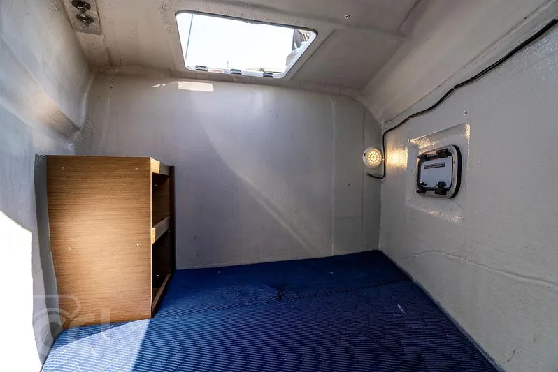 Flying B Yacht Photos Pics Interior cabin of 2021 Lagoon 46 yacht with skylight and shelving.