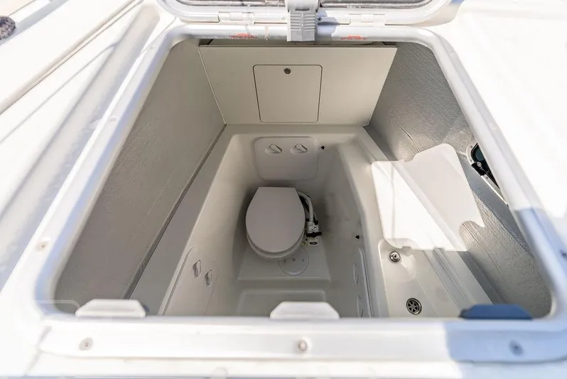 Flying B Yacht Photos Pics 2021 Lagoon 46 yacht bathroom compartment with compact toilet and storage space.