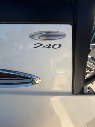  Yacht Photos Pics Close-up of 2024 Cobia 240 Center Console boat logo.