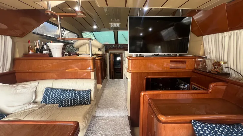 1522 Yacht Photos Pics Luxurious interior of a 1997 Ferretti Yachts 60 Flybridge with elegant wood finishes and modern amenities.