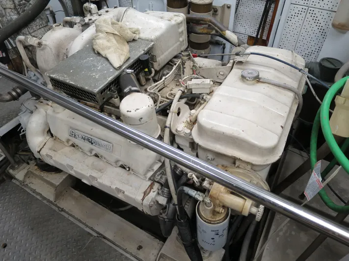 Water Doctor Yacht Photos Pics Engine room of 1988 DeFever 53POC yacht, featuring a well-maintained marine engine.