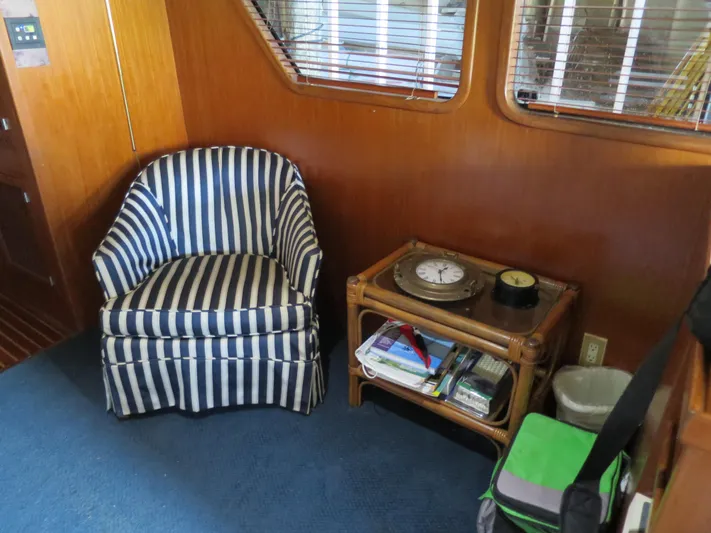 Water Doctor Yacht Photos Pics Striped chair and table in 1988 DeFever 53POC yacht interior.
