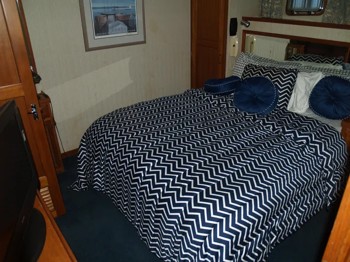 Water Doctor Yacht Photos Pics Cozy bedroom in 1988 DeFever 53POC yacht with chevron-patterned bedding.