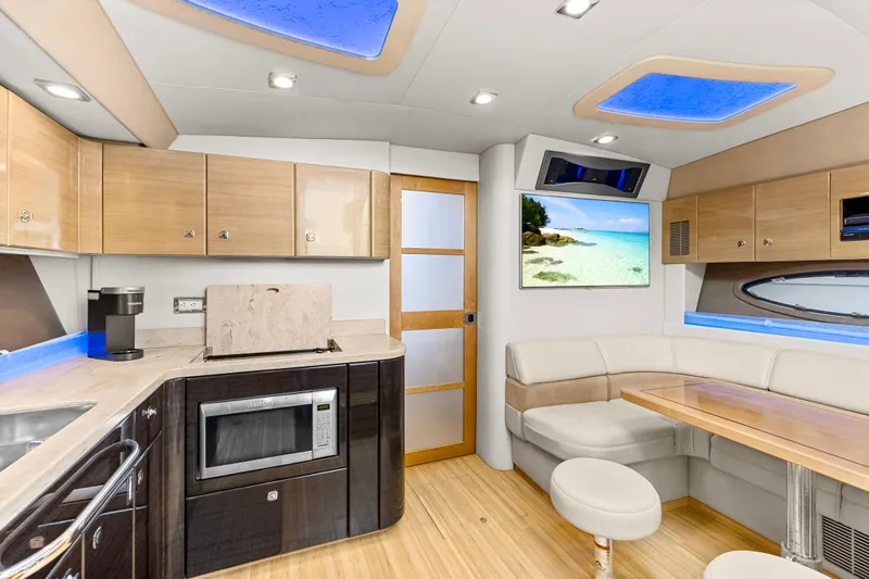 Black Diamond Yacht Photos Pics Luxurious interior of 2016 Formula 45 Yacht with modern kitchen and cozy seating area.