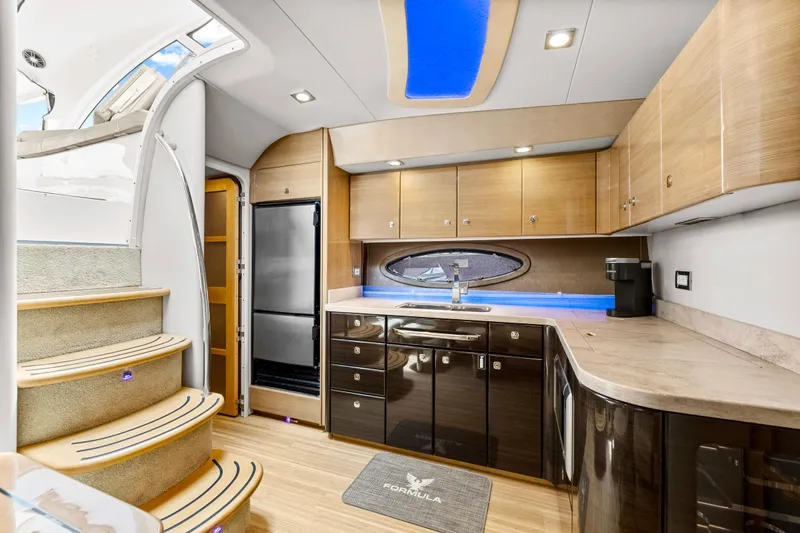 Black Diamond Yacht Photos Pics Luxurious interior of a 2016 Formula 45 Yacht with modern kitchen and elegant design.