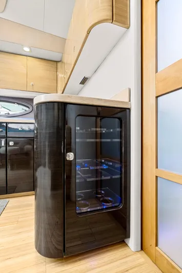 Black Diamond Yacht Photos Pics Modern interior of 2016 Formula 45 Yacht featuring sleek cabinetry and illuminated wine cooler.