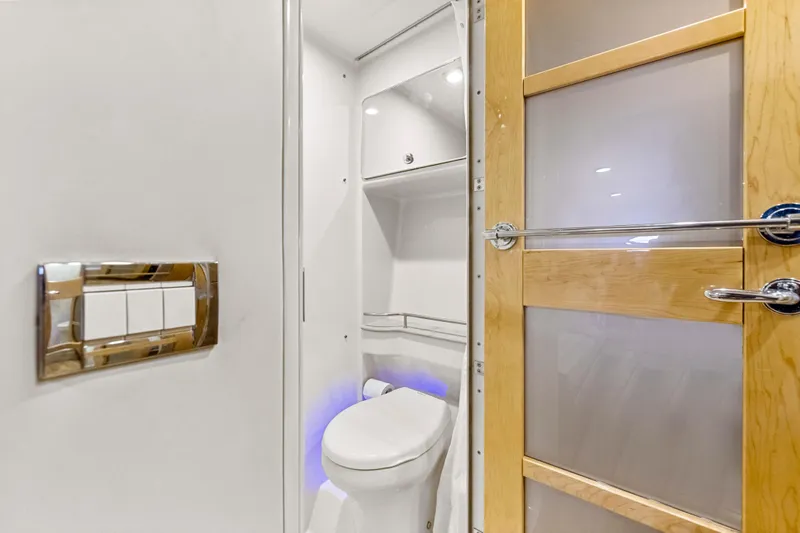 Black Diamond Yacht Photos Pics Modern bathroom interior on 2016 Formula 45 Yacht, featuring sleek design and wooden door accents.