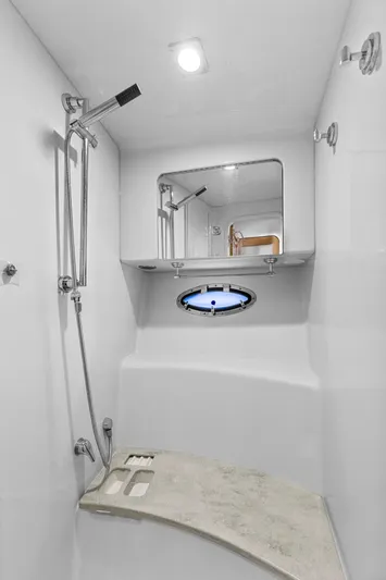 Black Diamond Yacht Photos Pics Shower area in 2016 Formula 45 Yacht with modern fixtures and porthole window.