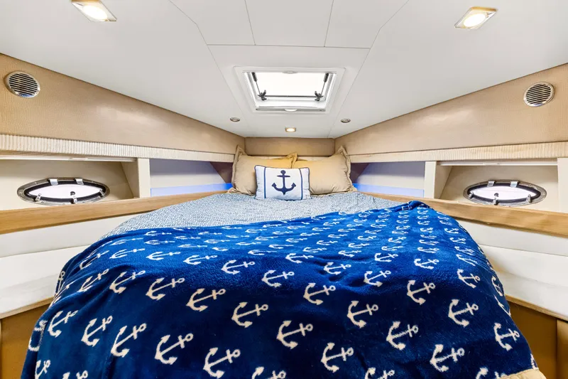 Black Diamond Yacht Photos Pics Cozy cabin interior of 2016 Formula 45 Yacht with nautical-themed bedding.