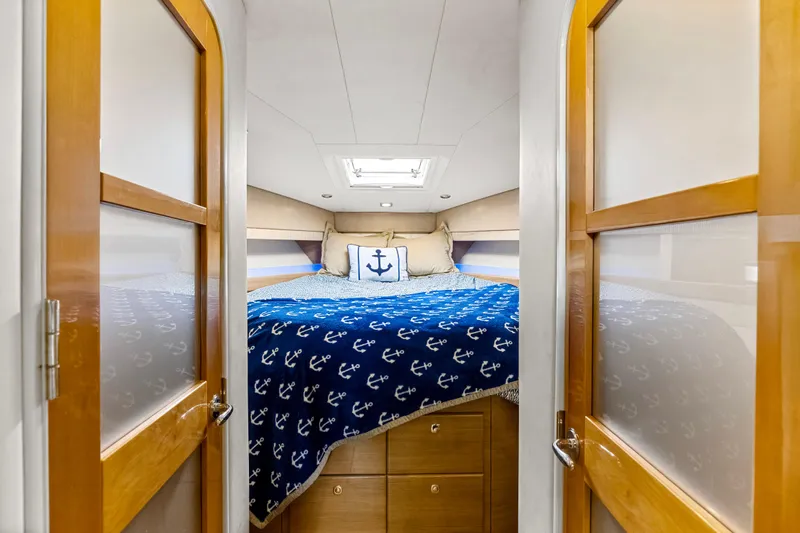 Black Diamond Yacht Photos Pics Luxurious cabin interior of 2016 Formula 45 Yacht with nautical-themed bedding.