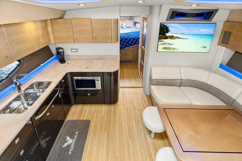 Black Diamond Yacht Photos Pics Luxurious interior of 2016 Formula 45 Yacht with modern kitchen and cozy seating area.