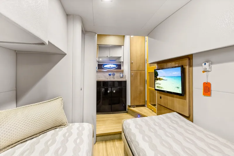 Black Diamond Yacht Photos Pics Luxurious interior of 2016 Formula 45 Yacht with twin beds and wall-mounted TV.