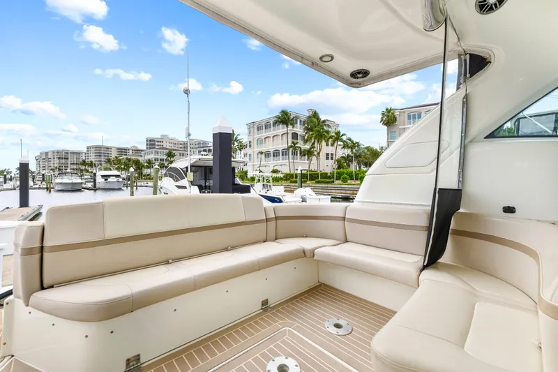 Black Diamond Yacht Photos Pics Luxurious seating area on a 2016 Formula 45 Yacht docked at a marina.