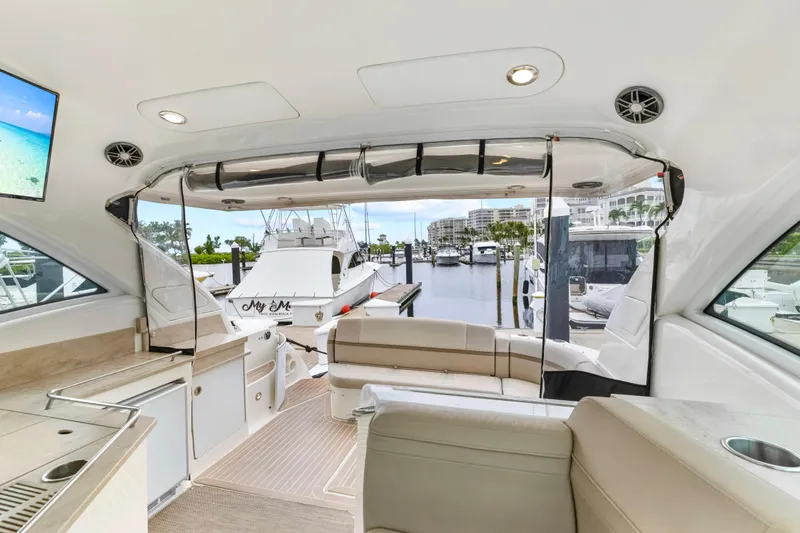 Black Diamond Yacht Photos Pics 2016 Formula 45 Yacht interior with luxurious seating and marina view.