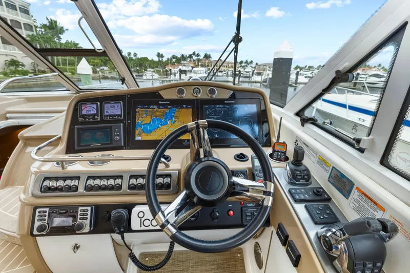 Black Diamond Yacht Photos Pics Helm of 2016 Formula 45 Yacht with navigation screens and controls, docked at marina.
