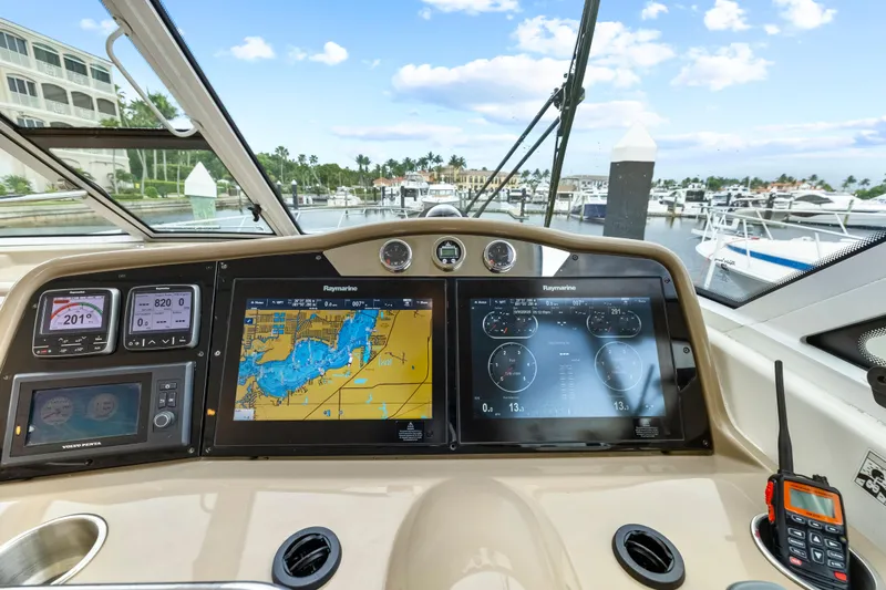 Black Diamond Yacht Photos Pics Helm of 2016 Formula 45 Yacht with navigation screens and marina view.