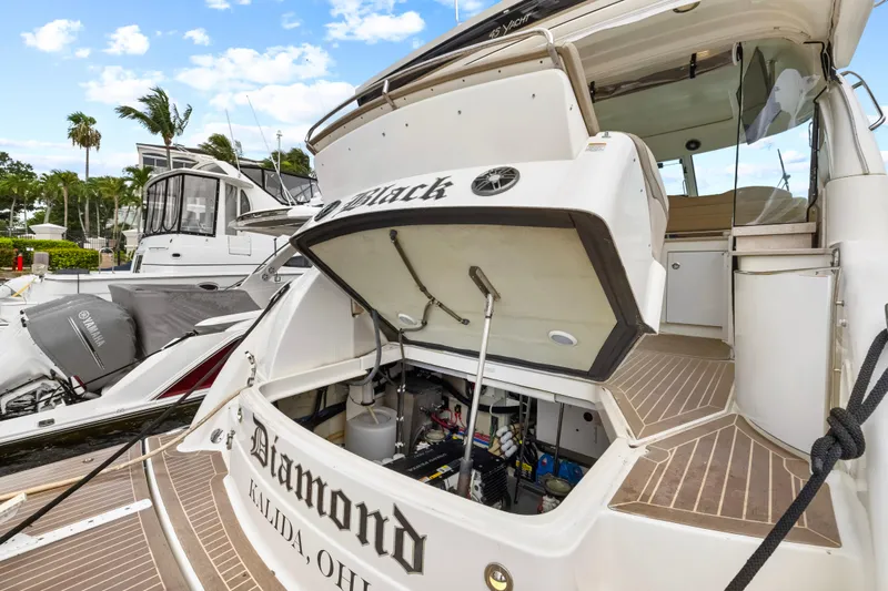 Black Diamond Yacht Photos Pics 2016 Formula 45 Yacht docked, open engine compartment, sunny marina setting.