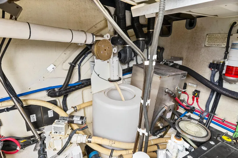 Black Diamond Yacht Photos Pics Engine room of a 2016 Formula 45 Yacht with various mechanical components and wiring.
