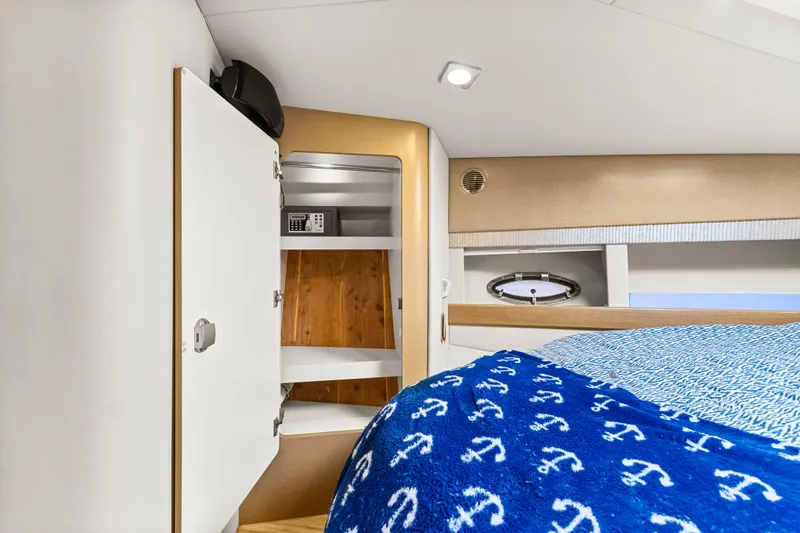 Black Diamond Yacht Photos Pics 2016 Formula 45 Yacht interior with bed, storage, and porthole.