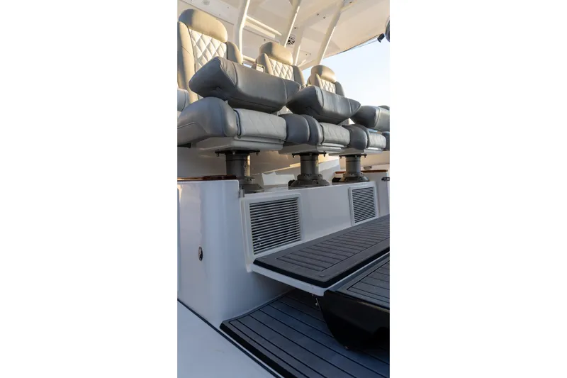 Almost Heaven Yacht Photos Pics 2024 Everglades 395 Center Console boat seating area with luxurious leather seats.