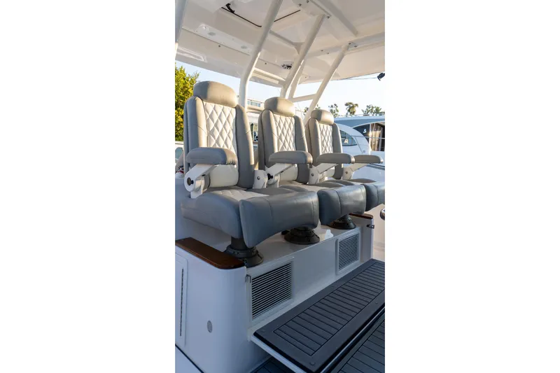 Almost Heaven Yacht Photos Pics Luxury seating on 2024 Everglades 395 Center Console boat, featuring plush, adjustable captain chairs.